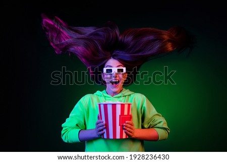 Photo of funny impressed young lady wear green sweater watching movie eating popcorn isolated colored bright shine background