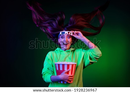 Photo of charming shocked lady wear green sweater watching scary movie eating popcorn isolated colored bright shine background