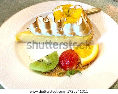 Deliciously looking lemon tart on white plate