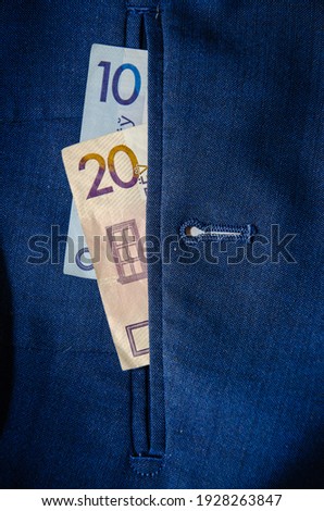 Belarusian rubles in the back pocket of jeans.