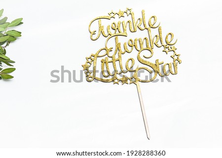 Twinkle twinkle little star letters. Cake real topper Royalty-Free Stock Photo #1928288360