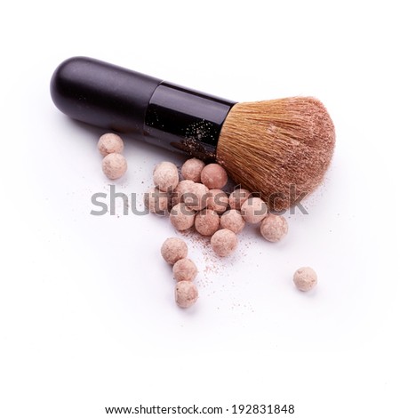 Powder ball with brush over white background 