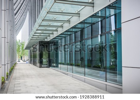 Cityscape office buildings with modern corporate architecture - business and success concept Royalty-Free Stock Photo #1928388911