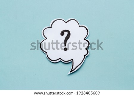 Question mark symbol on speech bubble, top view Royalty-Free Stock Photo #1928405609