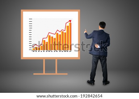 businessman hand drawing a graph. 