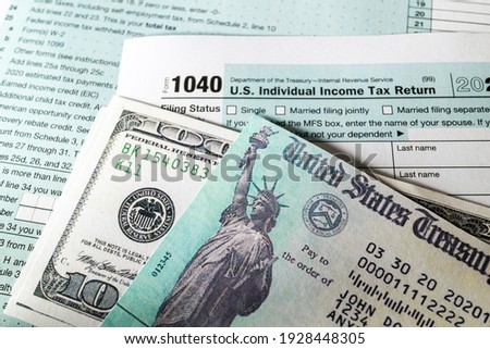 Stimulus economic tax return check and and 1040 Form. Royalty-Free Stock Photo #1928448305