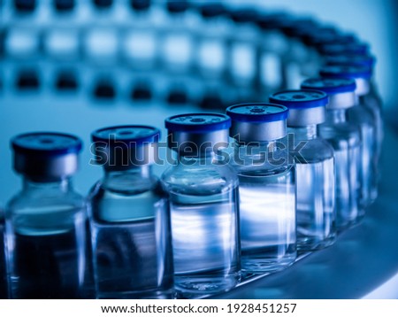 Group of Vaccine bottles. Medicine in ampoules. Glass vials for liquid samples in laboratory. Royalty-Free Stock Photo #1928451257