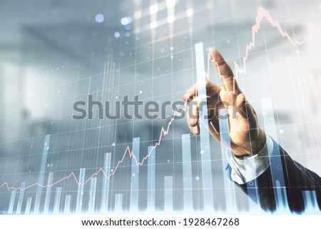 Multi exposure of businessman hand presses on virtual creative financial chart hologram on blurred office background, research and analytics concept Royalty-Free Stock Photo #1928467268