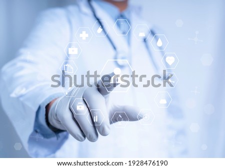 Doctor touch virtual screen with white icon medical on white background, medical technology network concept Royalty-Free Stock Photo #1928476190