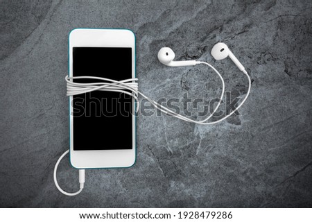Music player with mobile phone with earphones