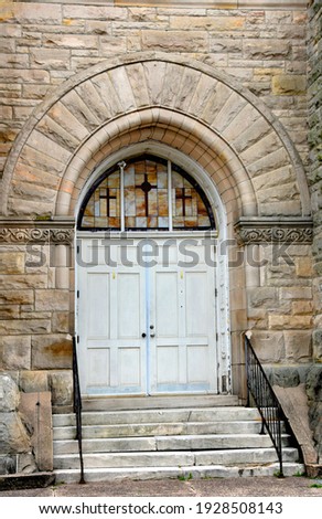 Historic Clayborn Temple was formerly the Second Presbyterian Church in Memphis, Tennessee.  Entry is stone arch and stained glass.  Crosses decorate glass.
