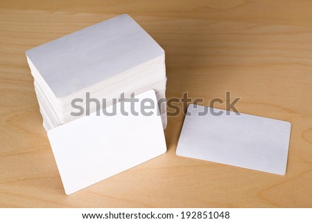 Business cards with rounded corners. Stack of blank horizontal business cards propped up another with copy space for your design.