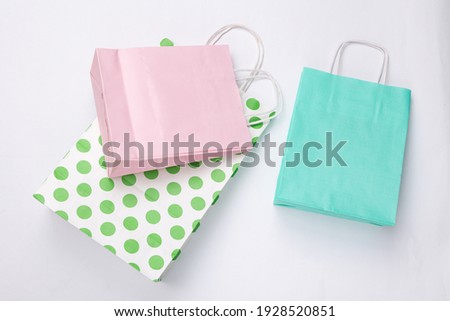 Paper shopping bags on white background.