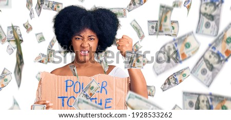 Young african american girl holding power to the people banner annoyed and frustrated shouting with anger, yelling crazy with anger and hand raised