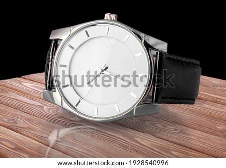 Beautiful luxury wrist watch on the desk