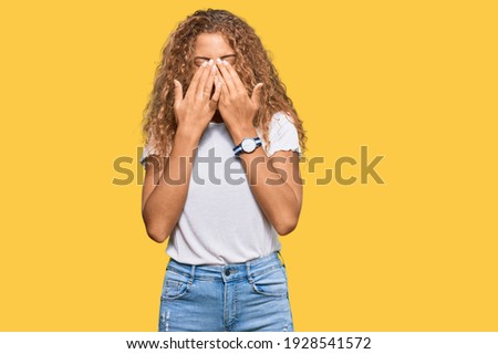 Beautiful caucasian teenager girl wearing casual white tshirt rubbing eyes for fatigue and headache, sleepy and tired expression. vision problem 