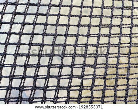 The mesh is woven into a grid.