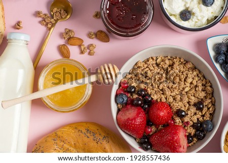 Festive brunch or breakfast set for Valentines day, Mothers day or Easter. Pink background. Overhead view .