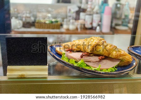 gastronomic croissant with meat and herbs. High quality photo