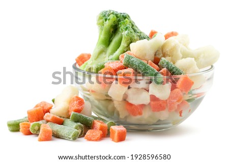 Frozen vegetables in a glass plate on a white background. Isolated