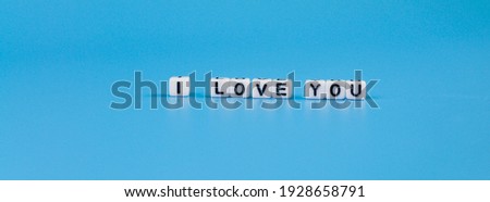 the inscription I love you made of cubes on a blue background