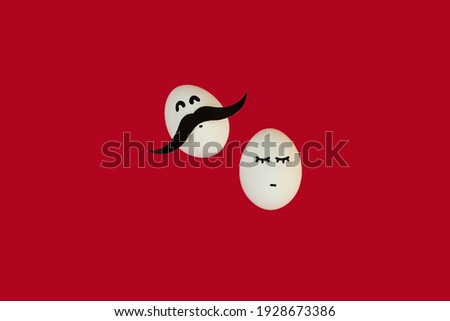 
funny white egg with a mustache and a cute egg with eyelashes on a red background. Happy easter