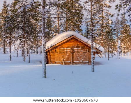 Winter landscape with cabin hut at lapland, Finland
