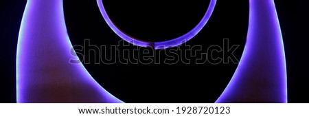 Collage photo of balconies, close-up bottom view. Abstract minimal futuristic or modern architecture. Hi-tech building with curved structure glowing in darkness. Geometric background with round shapes