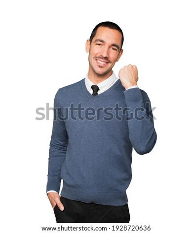 Happy young man doing a competitive gesture