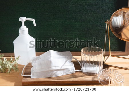 Masks and disinfectant. Image of preventive measures against new coronavirus (COVID-19) and infectious diseases. Royalty-Free Stock Photo #1928721788