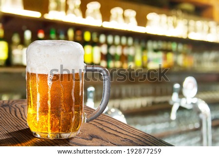 glass of beer in the pub Royalty-Free Stock Photo #192877259