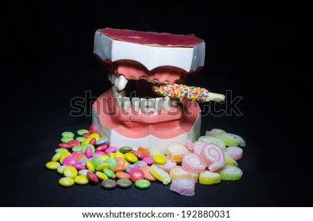 pile of candy whit broken tooth, still life