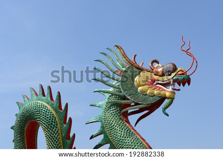 Dragon statue and natural blue sky background.