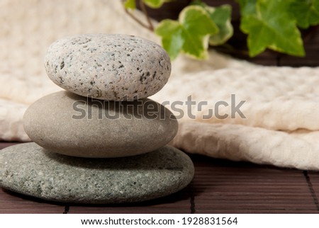 amazing natural pebble stone on white background isolated closeup, stack of balanced zen stones, smooth sea pebbles pyramid, round yoga stones, yoga rocks heap, stacked balance cobblestone on table