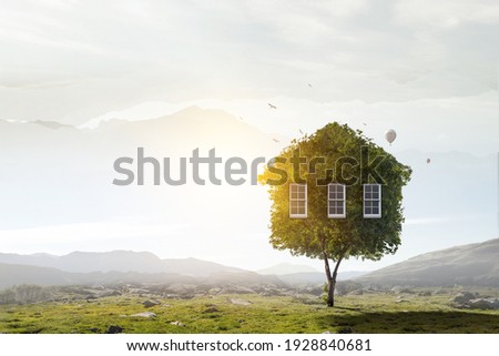 Little Eco House on the green grass Royalty-Free Stock Photo #1928840681