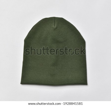 Green modern knitted beanie hat, knitwear isolated on white background