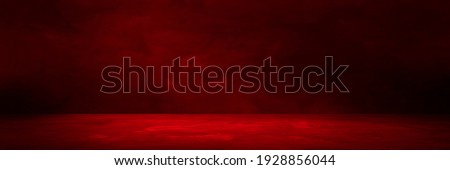 Empty red concrete floor and blurred wall backgrounds, dark room,  interior, use for product display for presentation and cover banner design. Royalty-Free Stock Photo #1928856044