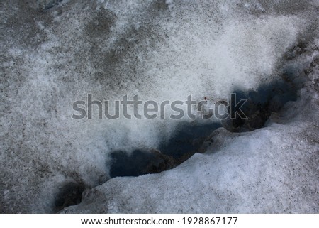 Close up view of a deep blue hole in Perito Moreno Glacier 