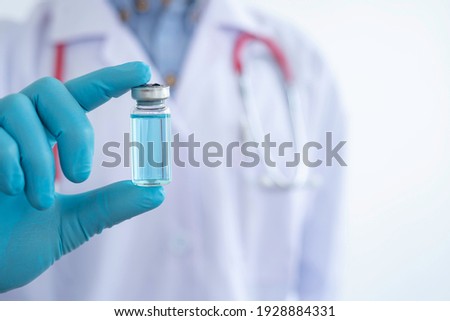 Doctors in blue gloves with new vaccine for coronavirus Certified by the World Health Organization Tested in children and the elderly, vaccine and treatment concepts