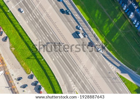 Cars driving on urban traffic road markup, aerial top view