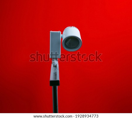 Studio  spot lighting on a red background