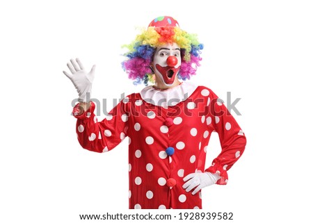 Funny cheerful clown waving isolated on white background Royalty-Free Stock Photo #1928939582
