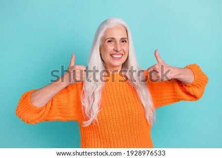 Photo of joyful happy old charming woman make thumbs up smile advertise isolated on teal color background