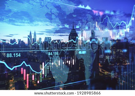 Forex trade market concept with digital indicators, graphs, financial diagram at night Kuala Lumpur city background. Double exposure Royalty-Free Stock Photo #1928985866