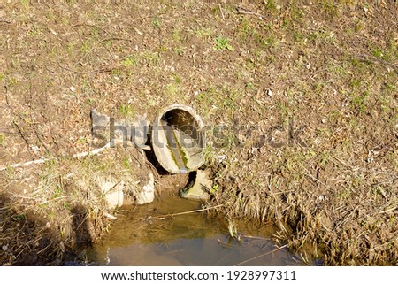 Sewer pipe on a small stream