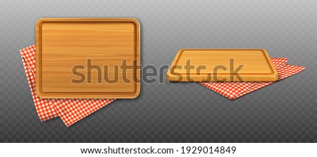 Wooden cutting board and red plaid tablecloth isolated on transparent background. Vector realistic set of 3d rectangle wood plank for cut food and folded table cloth with gingham pattern Royalty-Free Stock Photo #1929014849