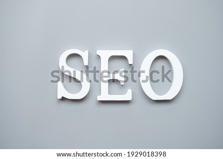 SEO (Search Engine Optimization) text on gray background. Idea, Vision, Strategy, Analysis, Keyword and Content concept