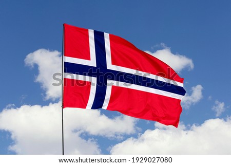 Norway flag isolated on sky background with clipping path. close up waving flag of Norway. flag symbols of Norway. Royalty-Free Stock Photo #1929027080