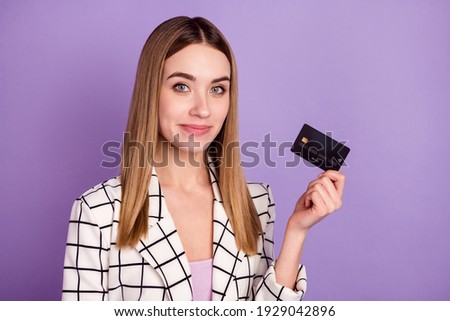 Photo of optimistic blond hair lady with card wear suit isolated on violet color background
