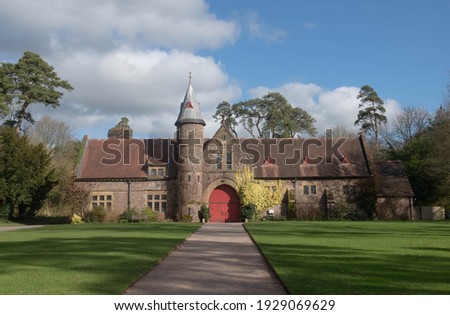 Victorian Gothic Stone Coach House and Horse Stables on a Bright Sunny Winter Day in the Rural Devon Countryside, England, UK